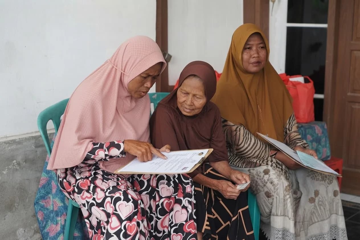 Three women reviewing a cervical screening form together